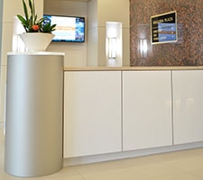 Hospitality desk with gloss white and silver